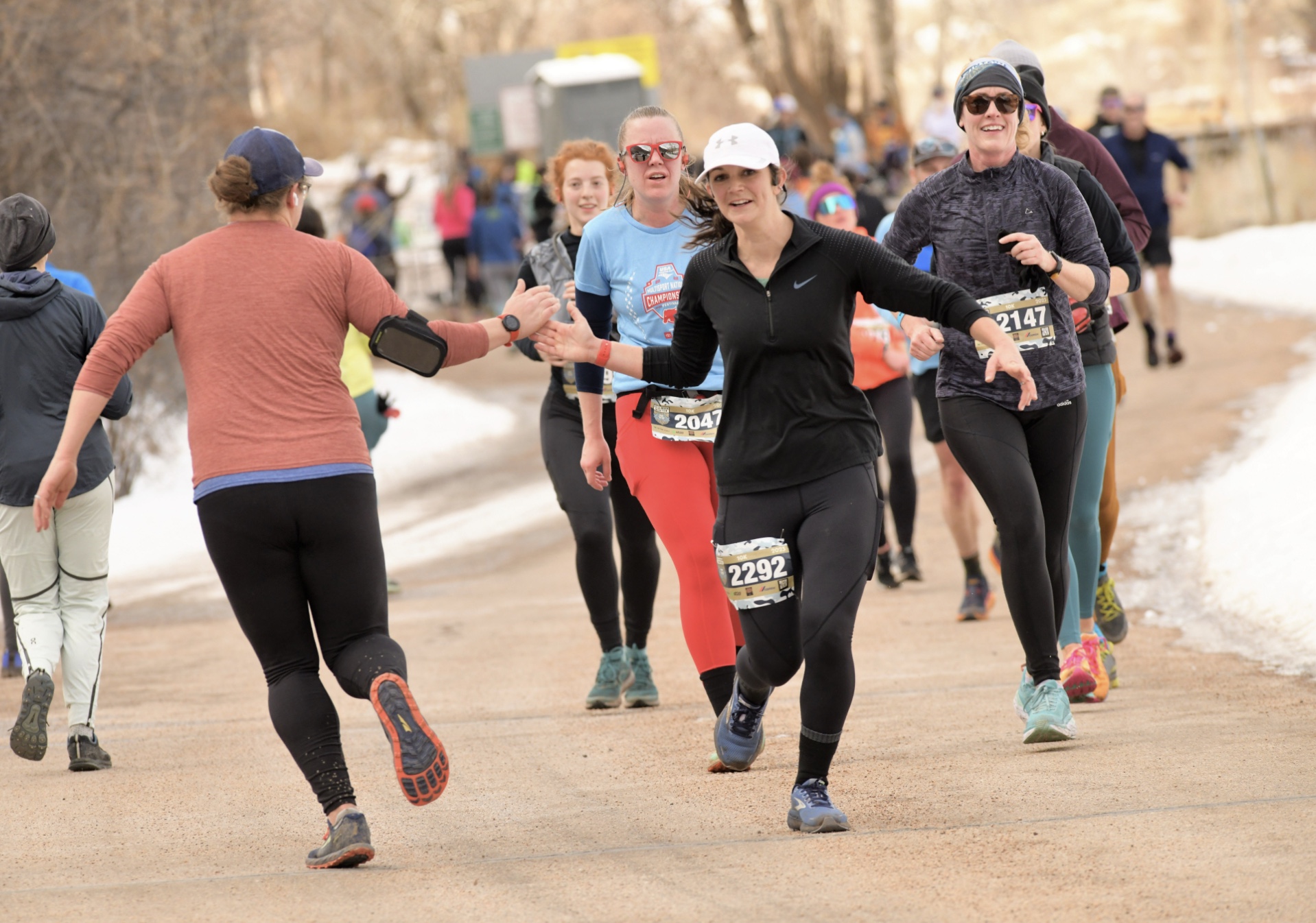 Runners giving high fives
