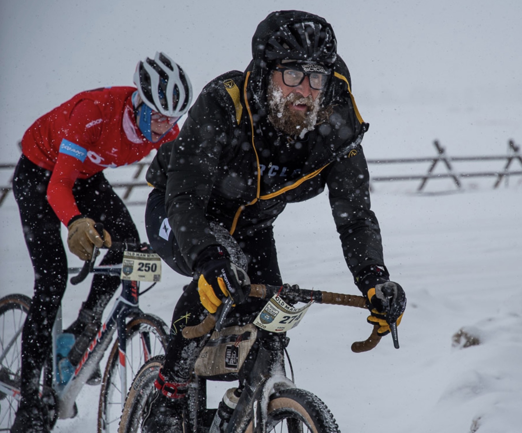 cyclists sliding snow on the Old Man Winter course