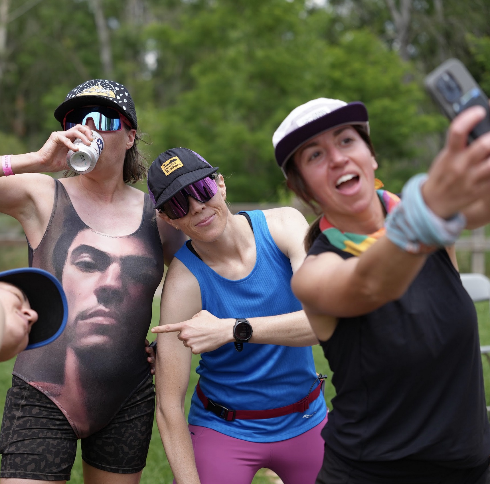 Runners high fiving at the Beer Relay exchange zone