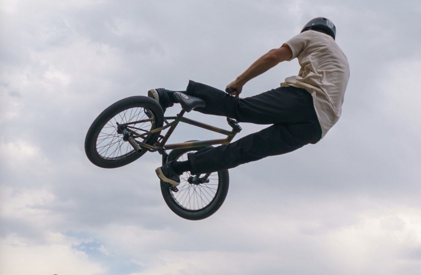 BMX rider mid-air over the plaza