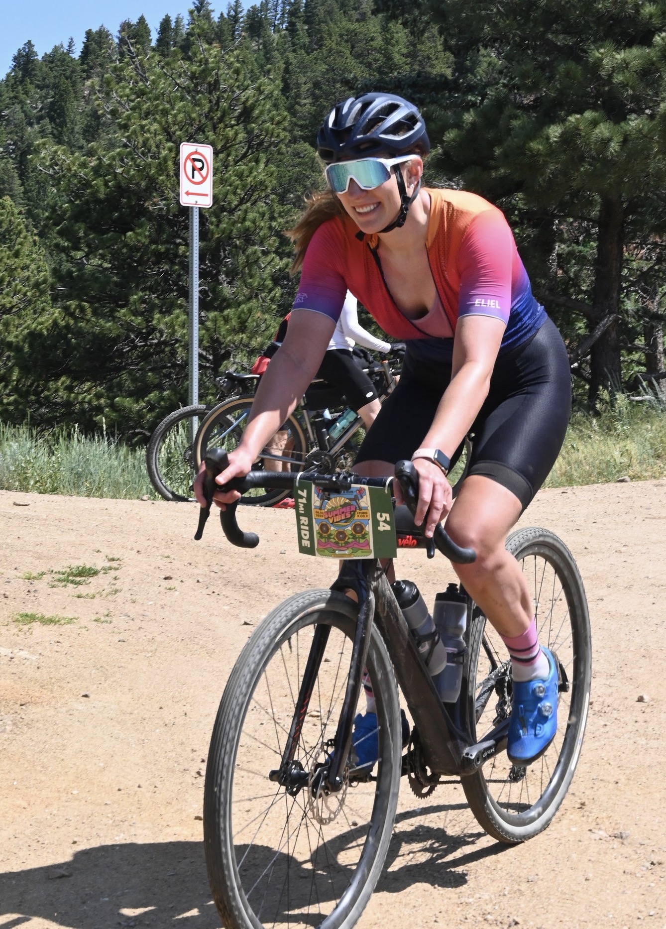 Rider climbing through pines